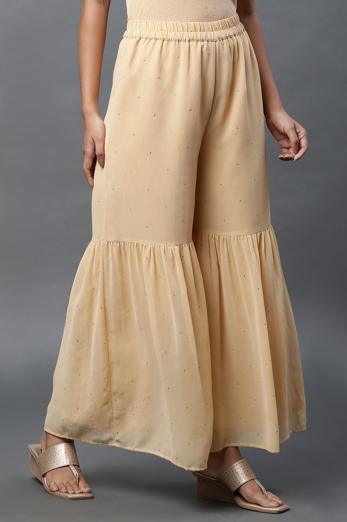 Gold Polka Dots Printed Flared Woven Palazzo With Elasticated Waist